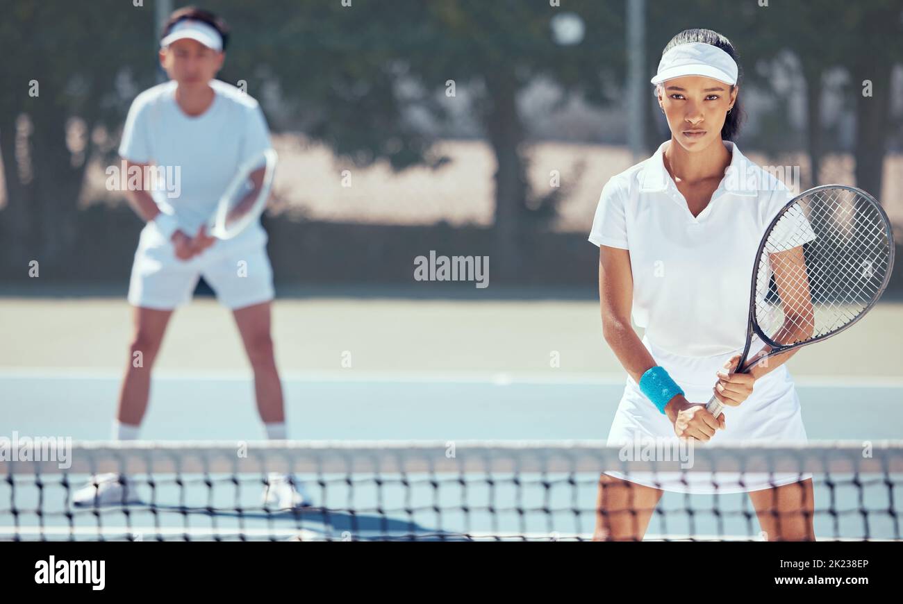 Determination, tennis and teamwork with athletes playing on game court training for sports fitness and exercise together. Motivation, health and Stock Photo