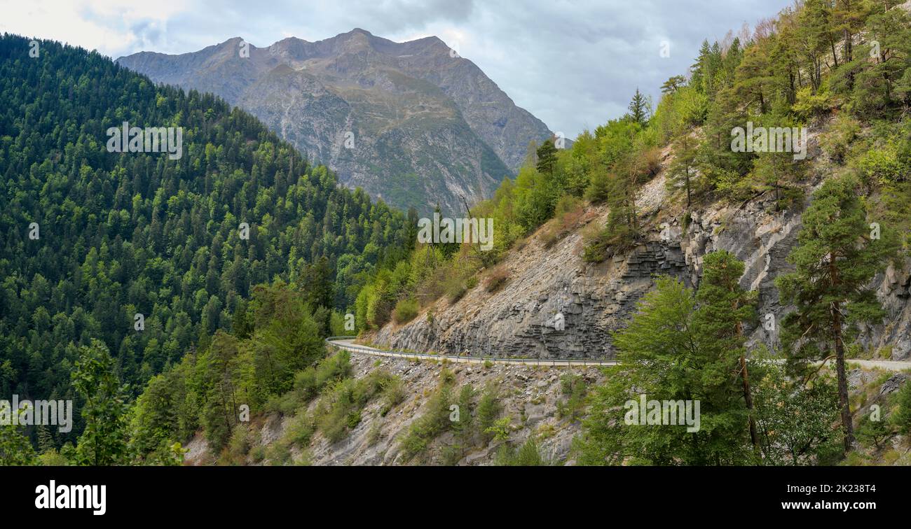 Male road cyclist descending from Villard Raymond to the Col d'Ornon in the French Alps, September 2022. Stock Photo