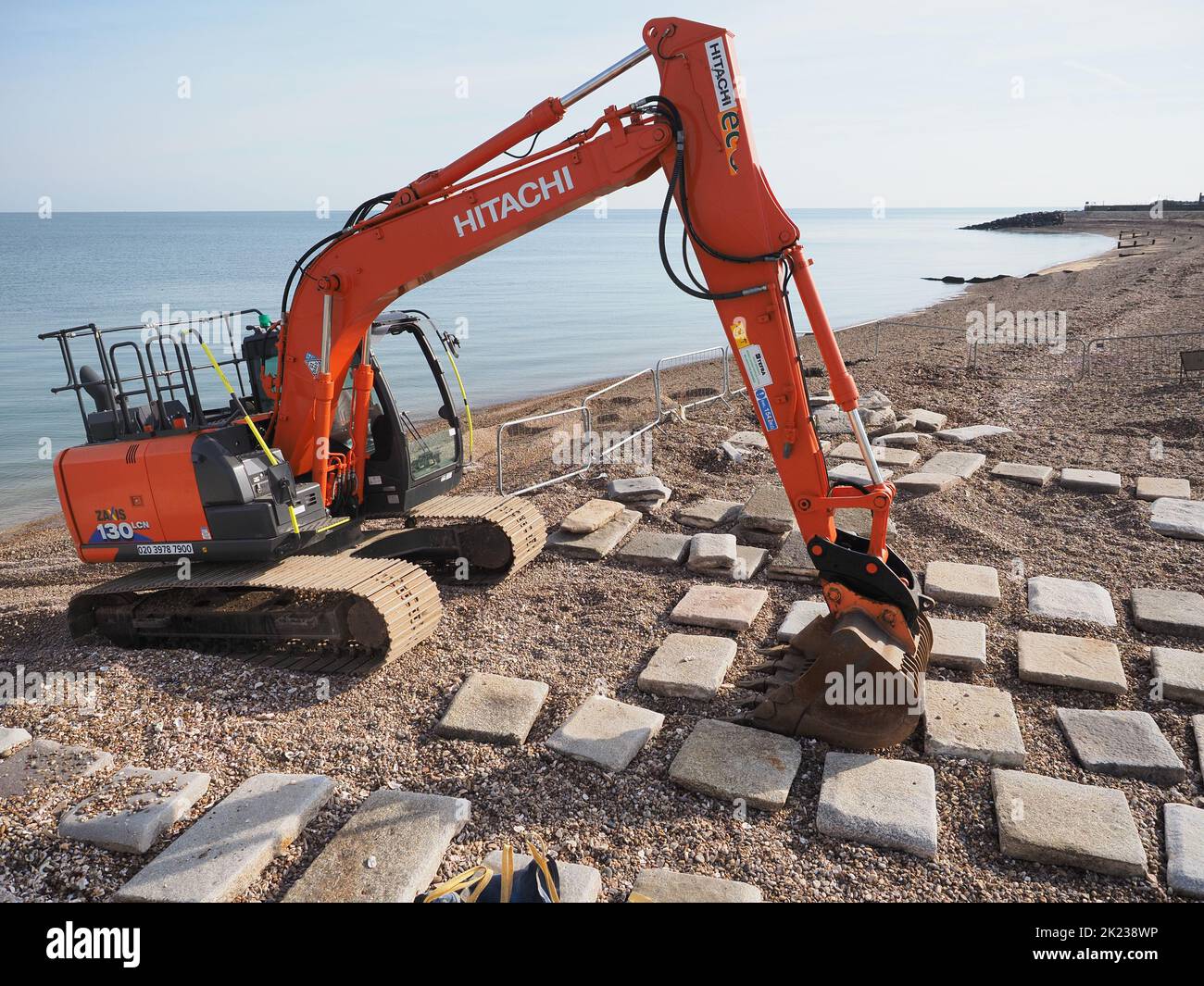 Sheerness, Kent, UK. 22nd Sep, 2022. Environment Agency contractors undertake repairs to the sea wall at Sheerness, Kent ahead of winter storms. A large number of flagstones were washed out by storms earlier this year in March and April, leaving the EA with a 'giant puzzle' of how to reinstate the flagstones they have recovered to fit the 'hole' in the sea wall. Credit: James Bell/Alamy Live News Stock Photo