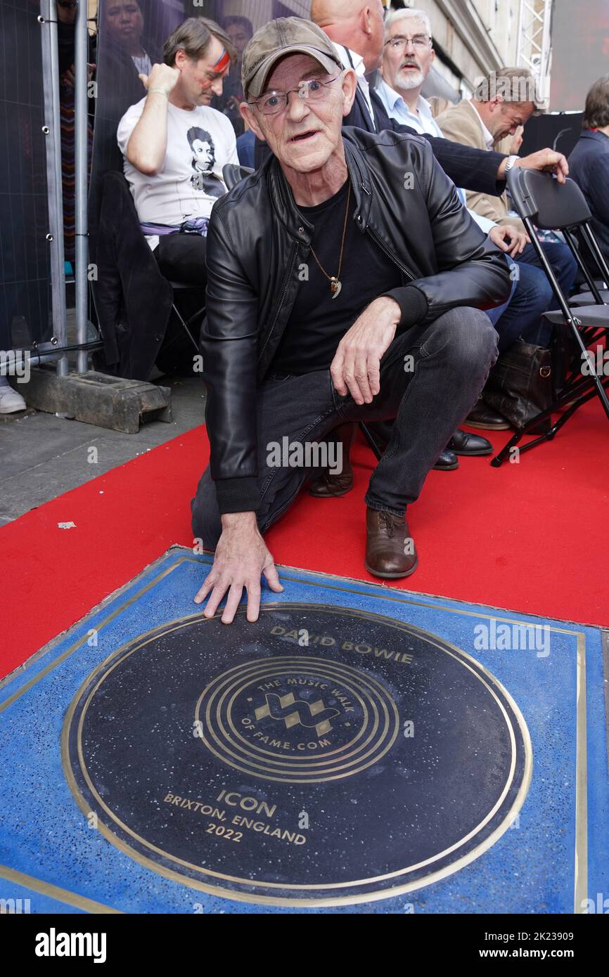Woody Woodmansey next to a stone for David Bowie which was unveiled on the Music Walk of Fame at Camden, north London. Picture date: Thursday September 22, 2022. Stock Photo