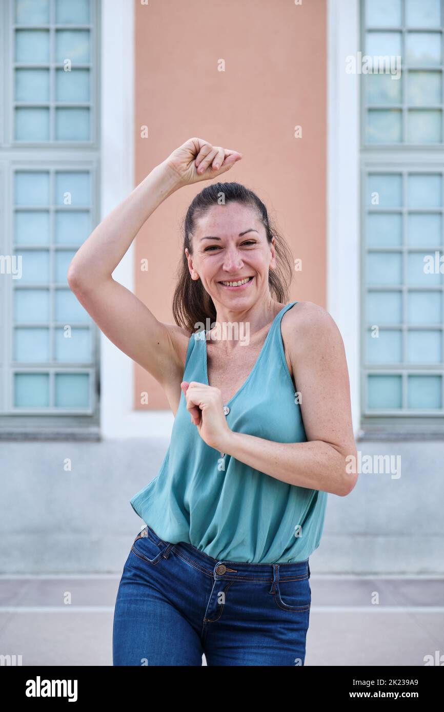 Woman dancing solo jazz in the street. Stock Photo