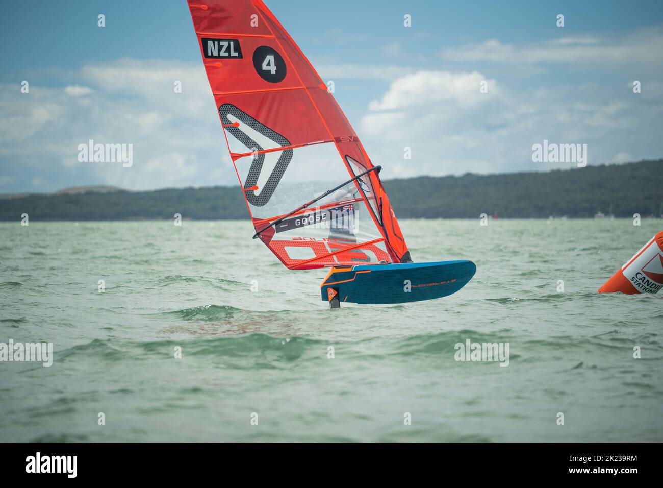 A man competes in a national windsurfing hydrofoil race at the