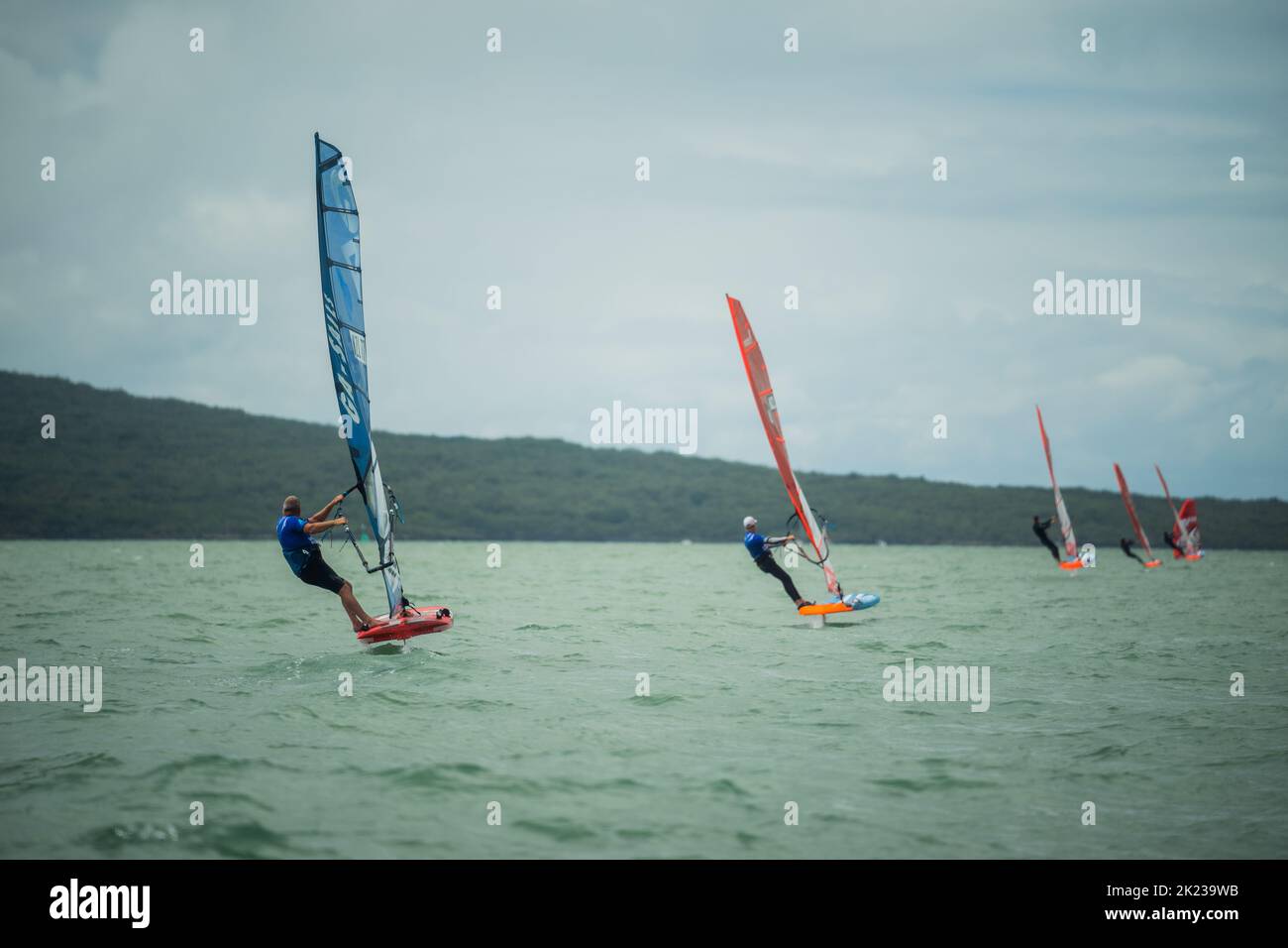 Competitors race in a national windsurfing hydrofoil race at the