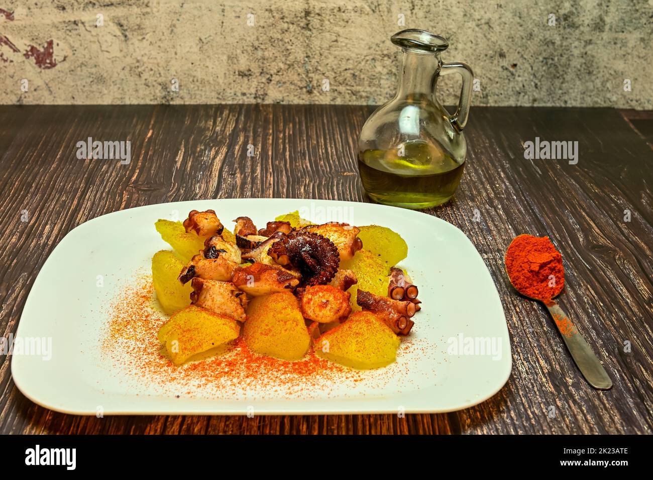 Octopus dish with potatoes, paprika and olive oil. Typical Spanish