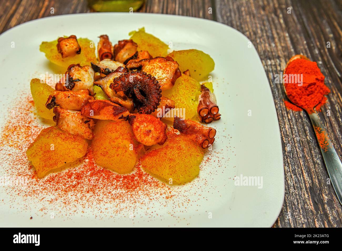 Octopus dish with potatoes, paprika and olive oil. Typical Spanish
