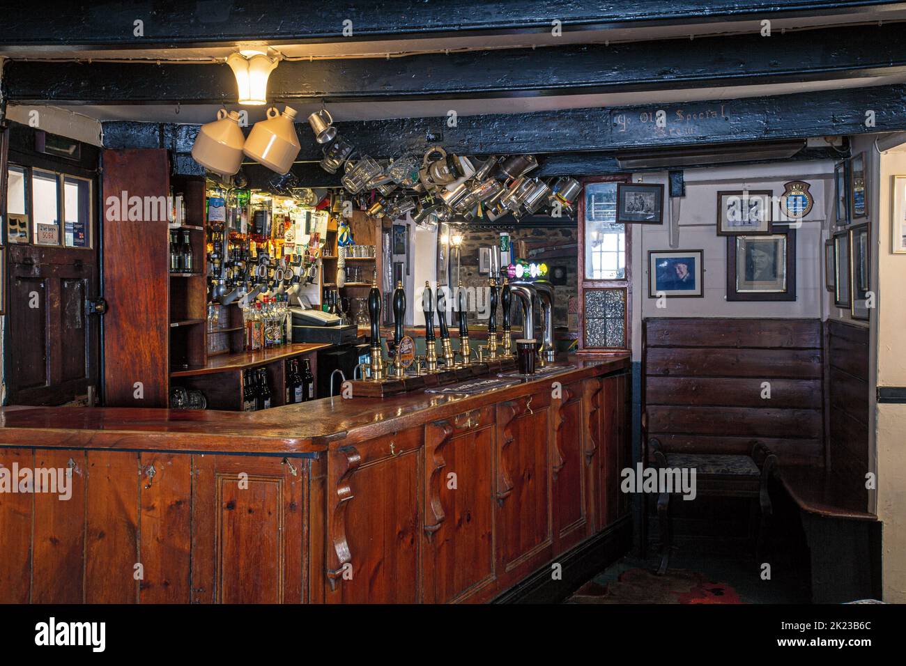 Interior of The Blue Anchor Inn pub bar counter with beer pumps in Helston , Cornwall, England . Stock Photo