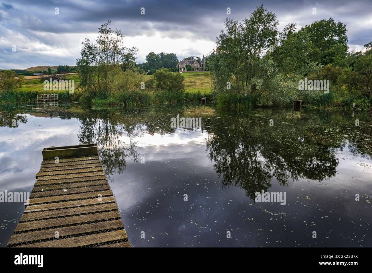 Kirk Yetholm, Scottish Borders, UK – Fishing stages on Yetholm Loch looking to the lodge Stock Photo