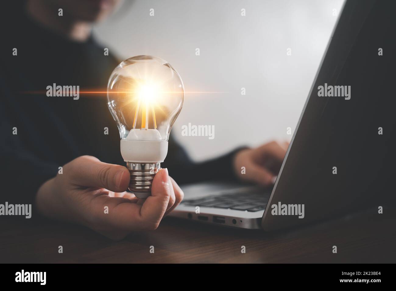 Innovation design concept. Hand holding light bulb for new idea brain ...