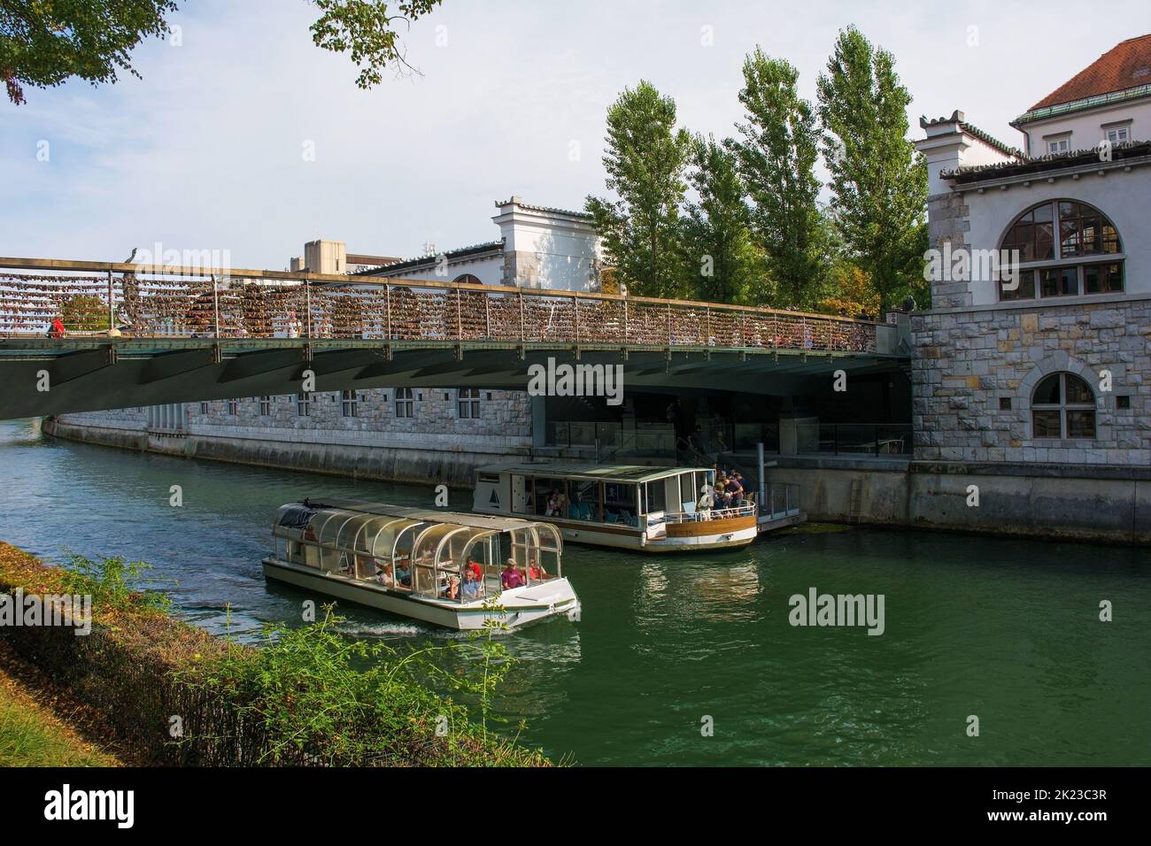 Ljubljana, Slovenia - September 3rd 2022. Tourist boats pass under