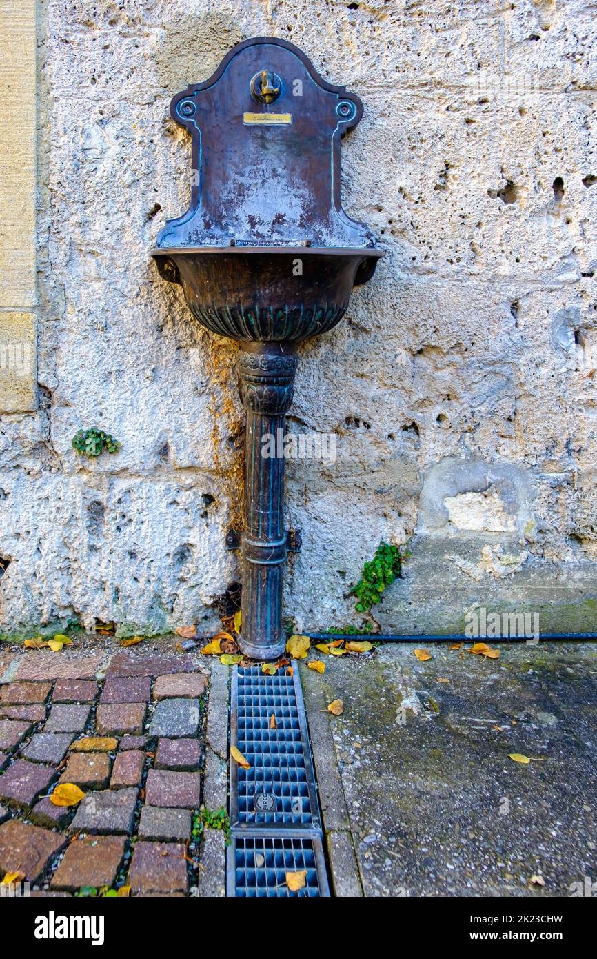 Public water supply, water tap with drinking water connection and sink at the Klostermuhle town museum, Bad Urach, Swabian Alb, Germany. Stock Photo