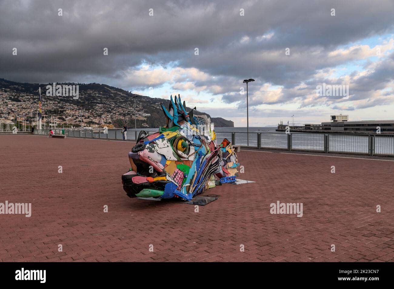 FUNCHAL, PORTUGAL - AUGUST 24, 2021: This is an art installation made of trash in the shape of a fish on the urban evening embankment. Stock Photo