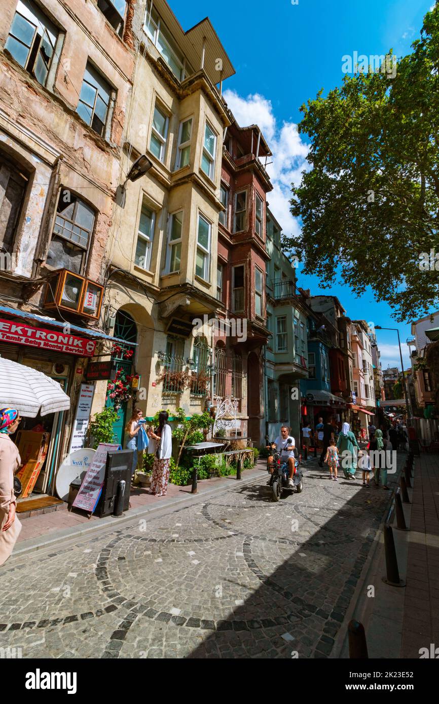 Travel to Istanbul vertical photo. Tourists in a street of Balat district. Istanbul Turkey - 8.20.2022 Stock Photo