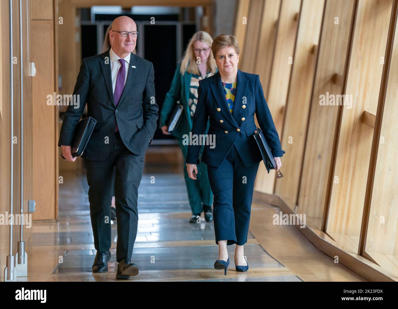 First Minister Nicola Sturgeon and Deputy First Minister John Swinney (left) arrive ahead of First Minster's Questions (FMQ's) in the debating chamber of the Scottish Parliament in Edinburgh. Picture date: Thursday September 22, 2022. Stock Photo