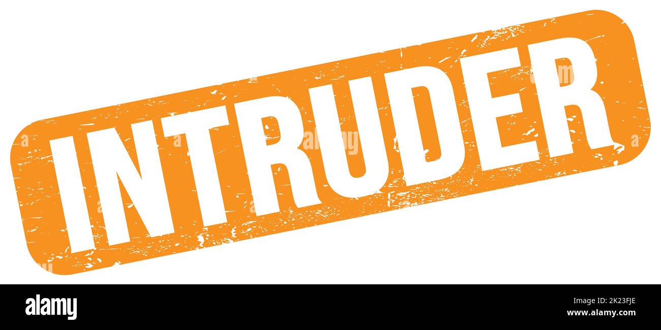 INTRUDER text written on orange grungy stamp sign. Stock Photo