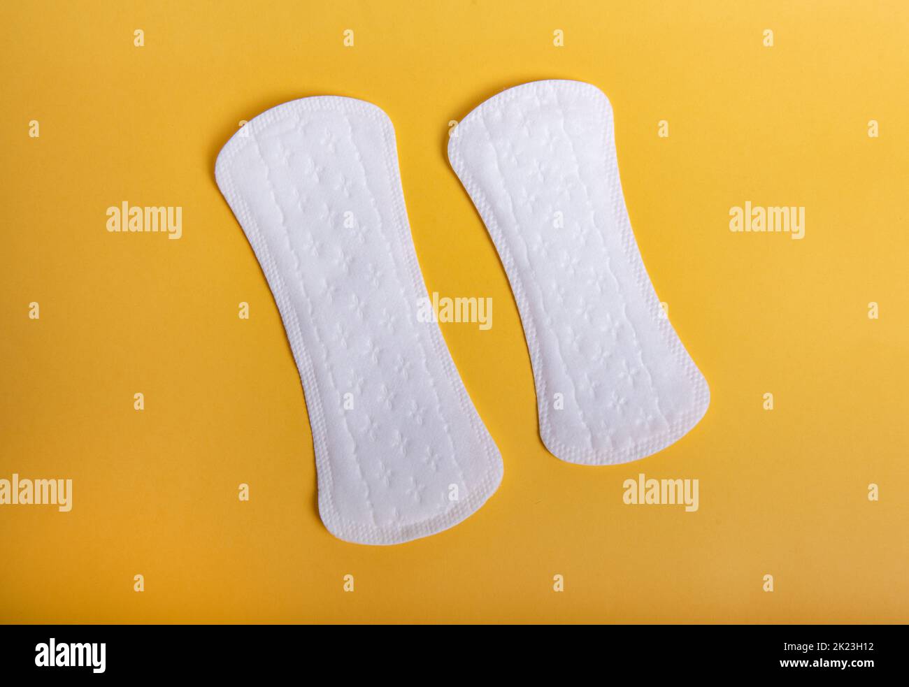 Menstrual pads on orange background. Stock Photo