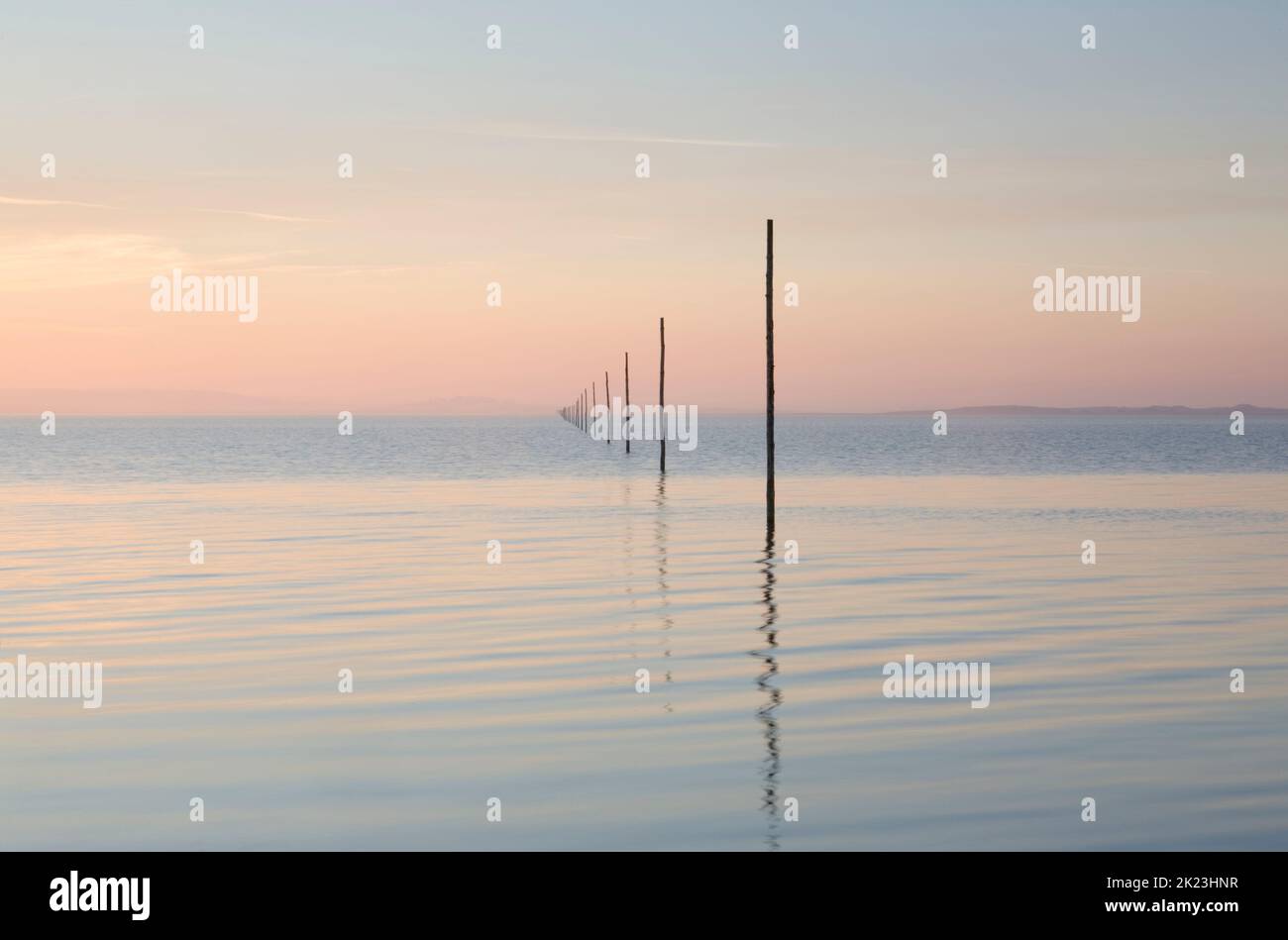 The posts marking the Pilgrims Way linking the Northumberland mainland to Holy Island (Lindisfarne) Stock Photo