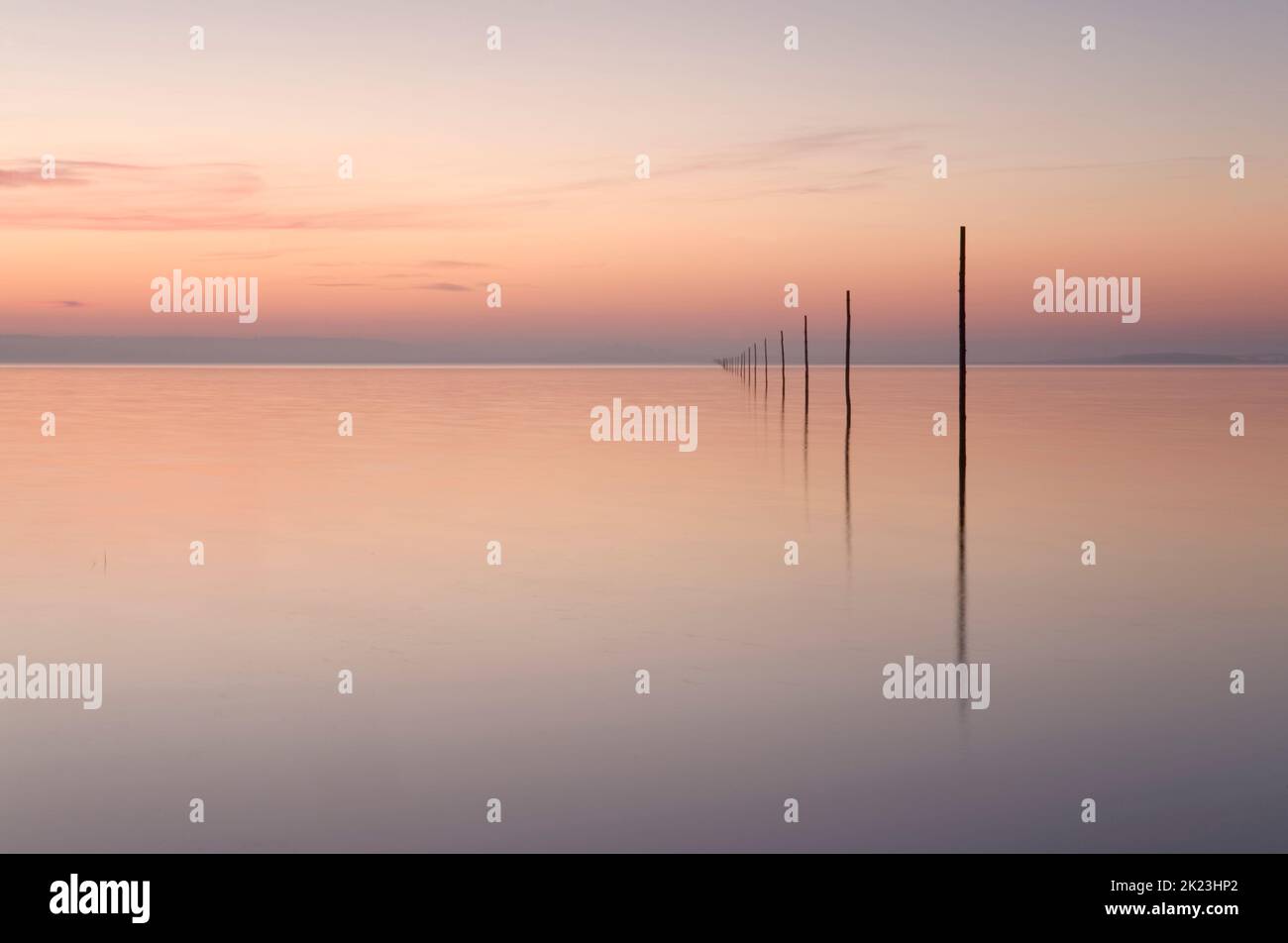 The posts marking the Pilgrims Way linking the Northumberland mainland to Holy Island (Lindisfarne) Stock Photo