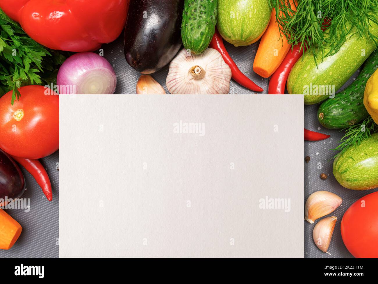 Empty sheet of paper on the background of vegetables. Stock Photo