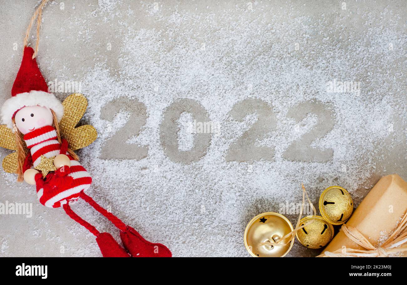 Festive season 2022 on grey with snow and rustic décor Stock Photo
