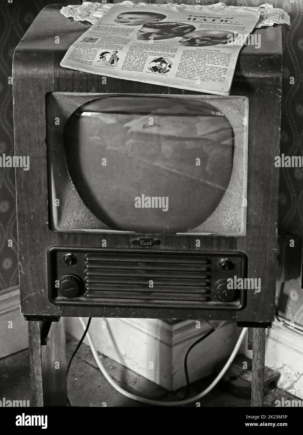 Original Bush, 1960s TV set, 405 line receiver, with Television guide to two channels, resting on top Stock Photo