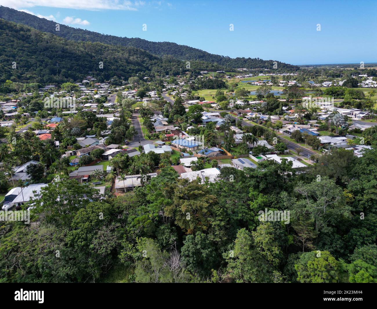 Aerial view of tropical housing estate around mountains in Queensland