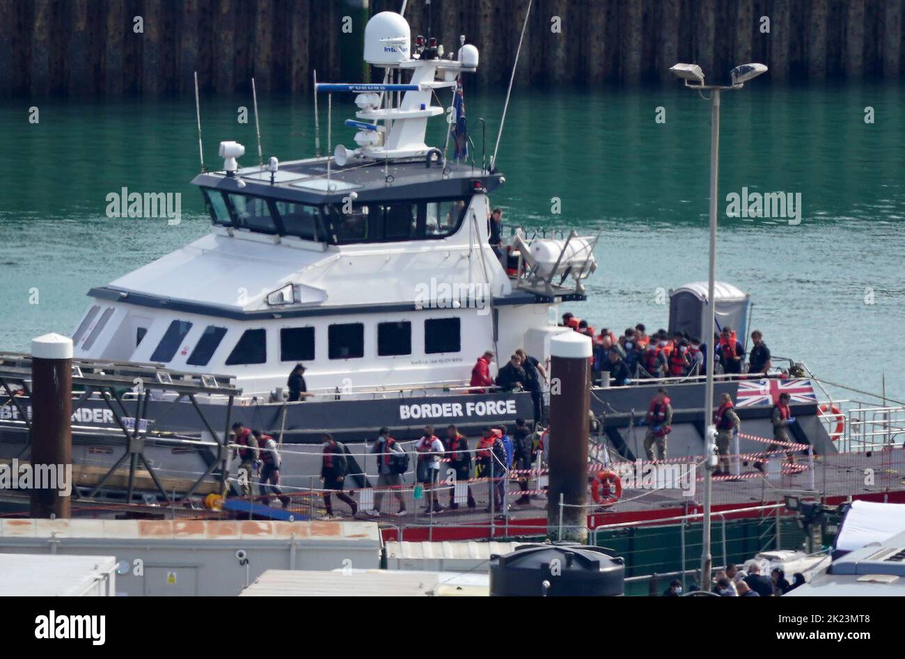 A group of people thought to be migrants are brought in to Dover, Kent, from a Border Force vessel following a small boat incident in the Channel. Picture date: Thursday September 22, 2022. Stock Photo