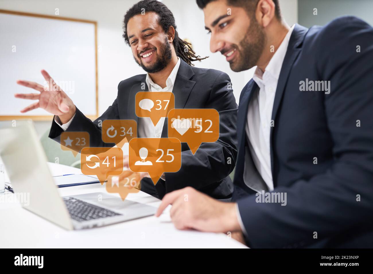 Two business people in the start-up creative team use social media together Stock Photo