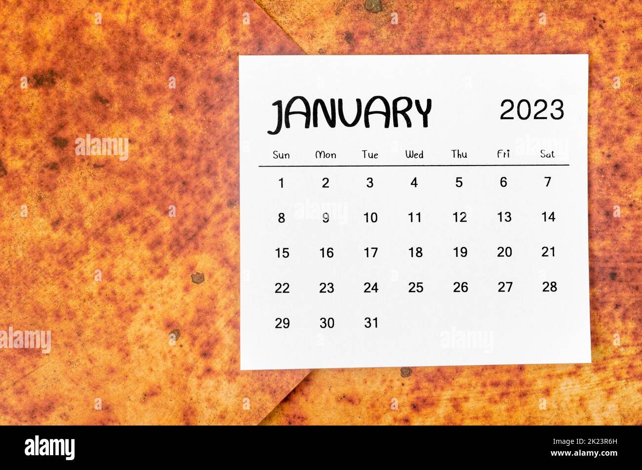 January 2023 Monthly calendar for 2023 year on red grunge background. Stock Photo