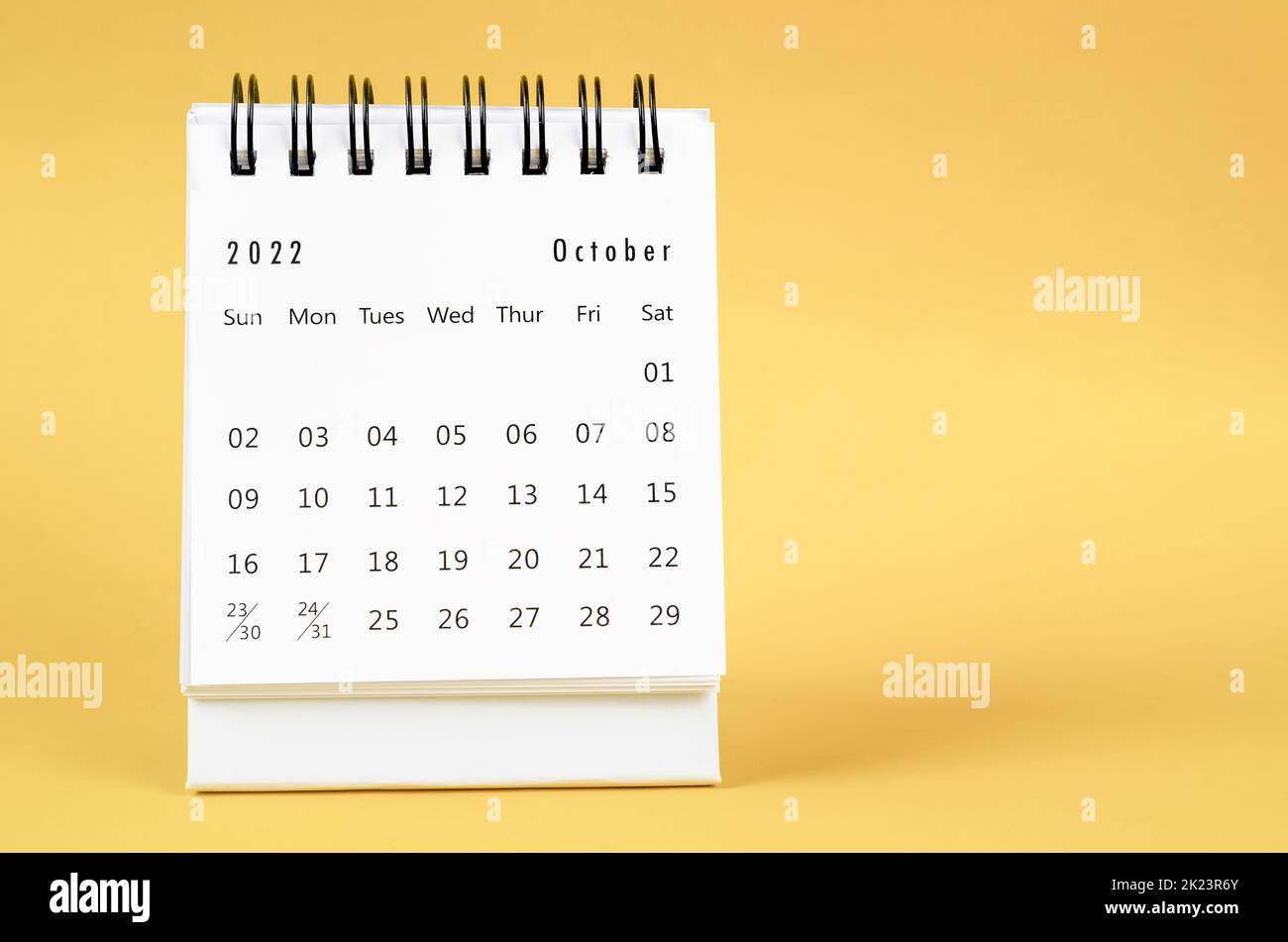 December 2022 Monthly desk calendar for 2022 year on yellow background. Stock Photo