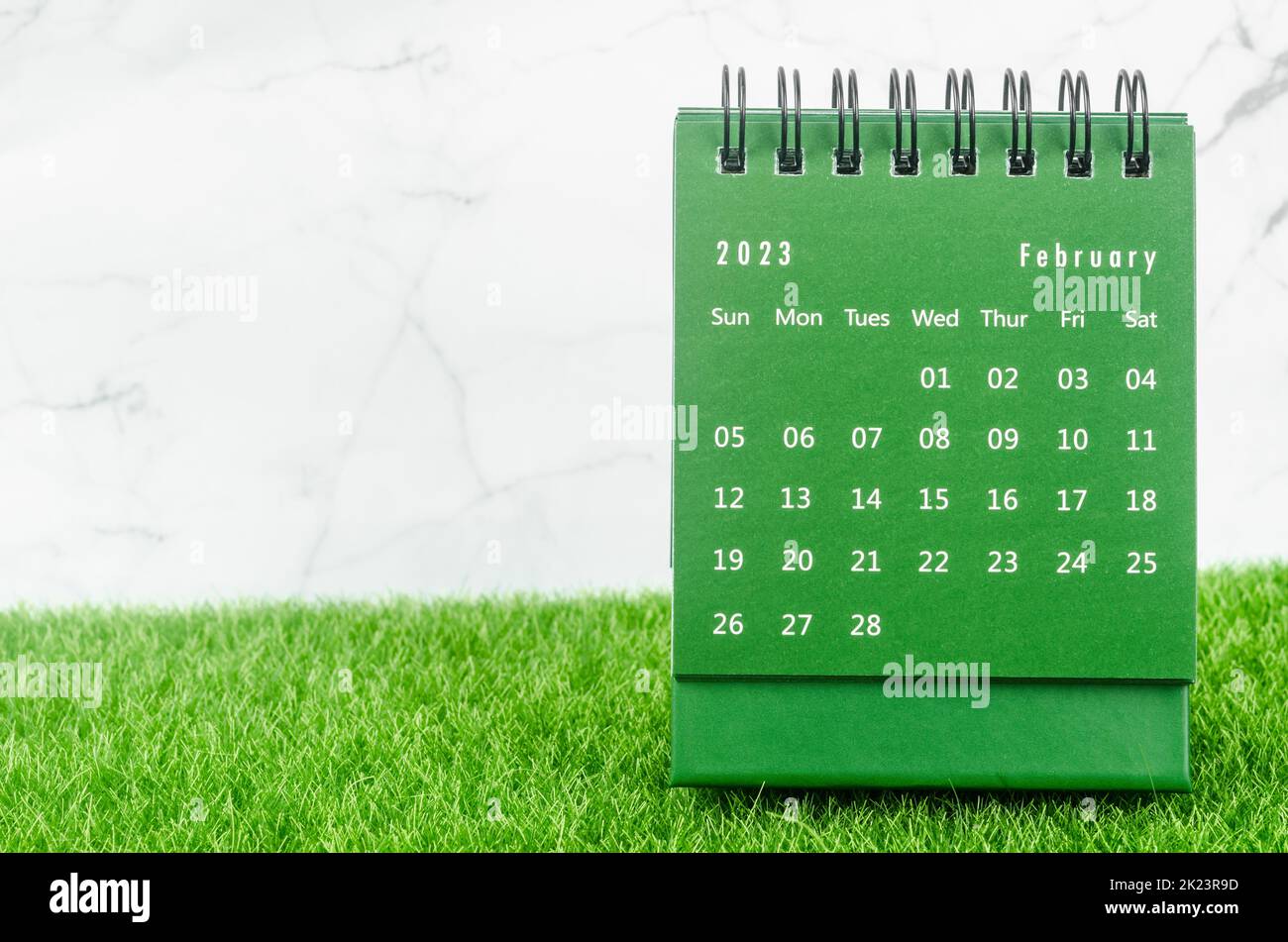 Green February 2023 Monthly desk calendar for 2023 year on grass. Stock Photo