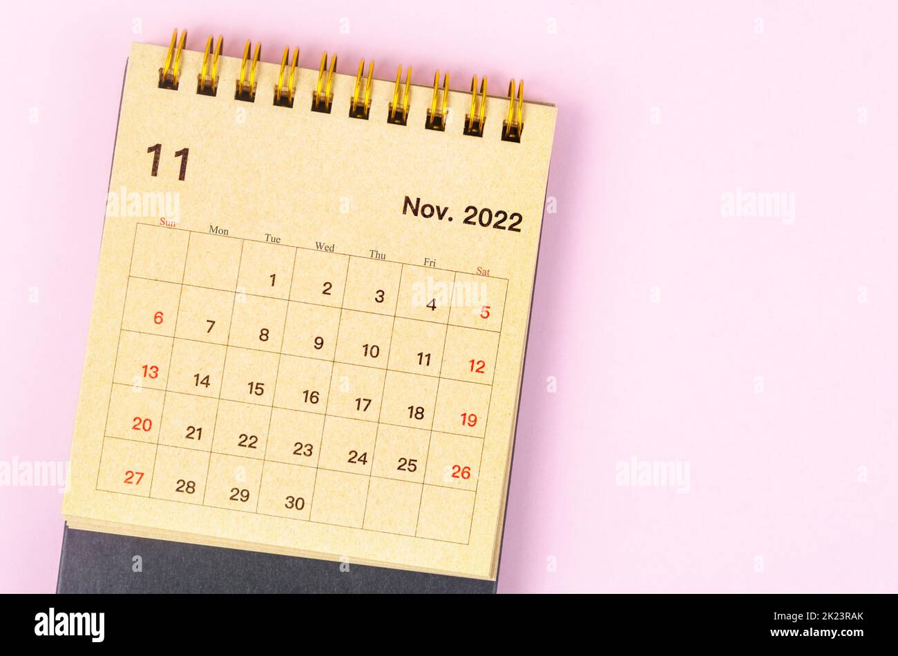 November 2022 Monthly desk calendar for 2022 year made from craft paper on beautiful background. Stock Photo