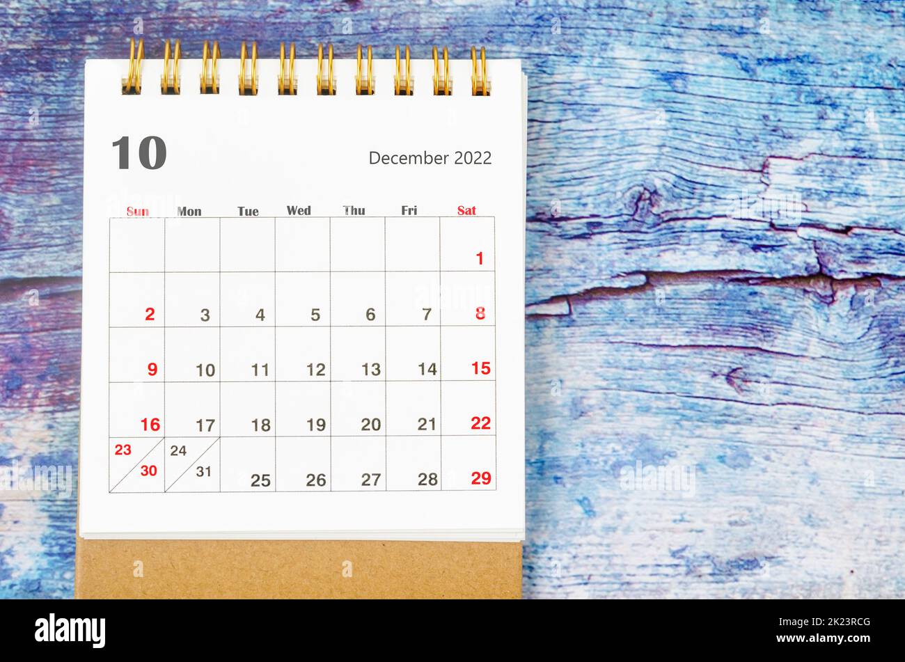 December 2022 Monthly desk calendar for 2022 year on old blue wooden background. Stock Photo