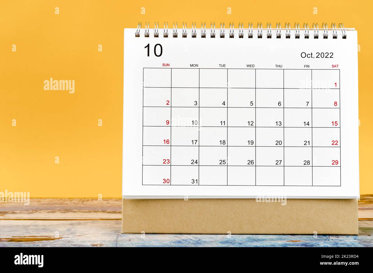 December 2022 Monthly desk calendar for 2022 year on yellow background. Stock Photo