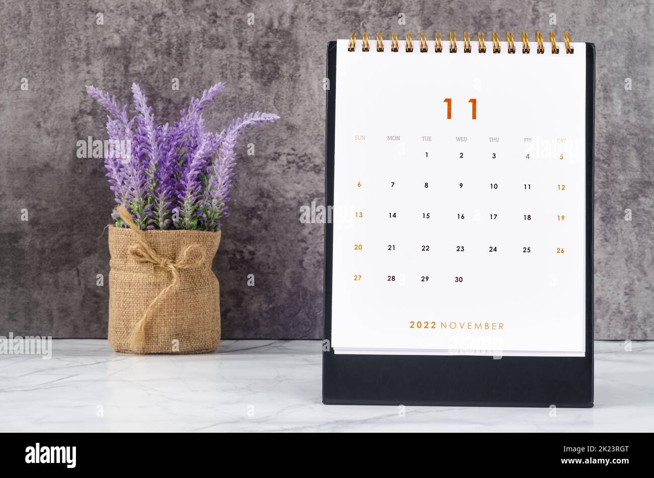 November 2022 Monthly desk calendar for 2022 year on the table. Stock Photo
