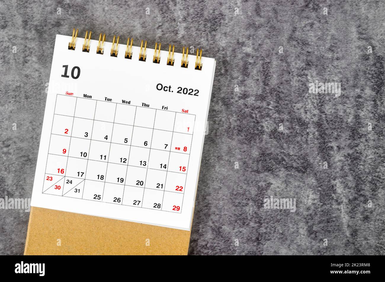October 2022 Monthly desk calendar for 2022 year on wooden table. Stock Photo