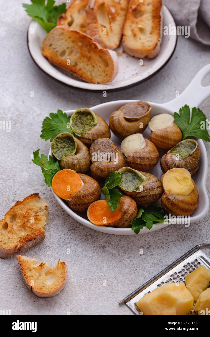 Baked snails Escargot with bread Stock Photo