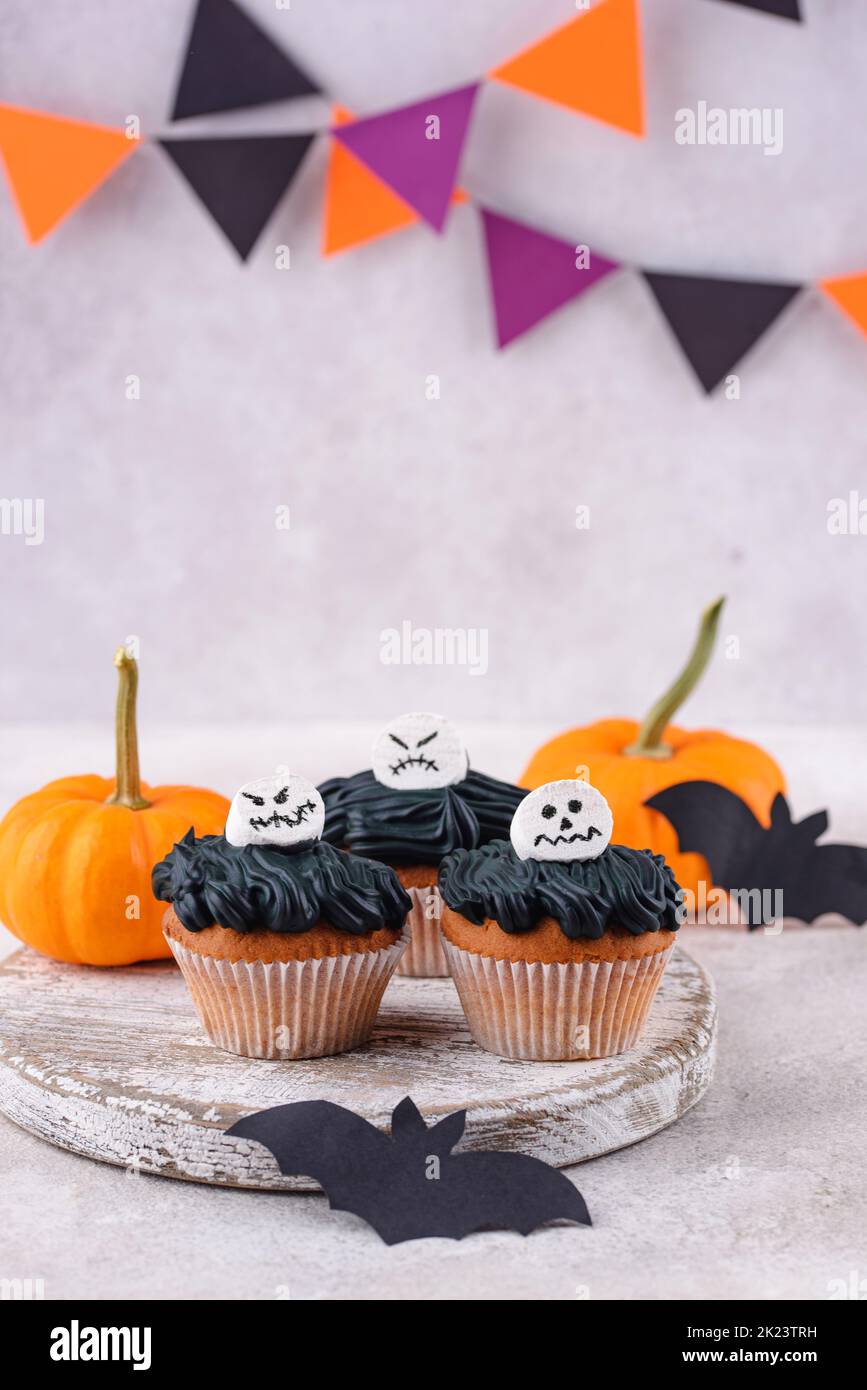 Scary Halloween cupcakes with spooky decoration Stock Photo