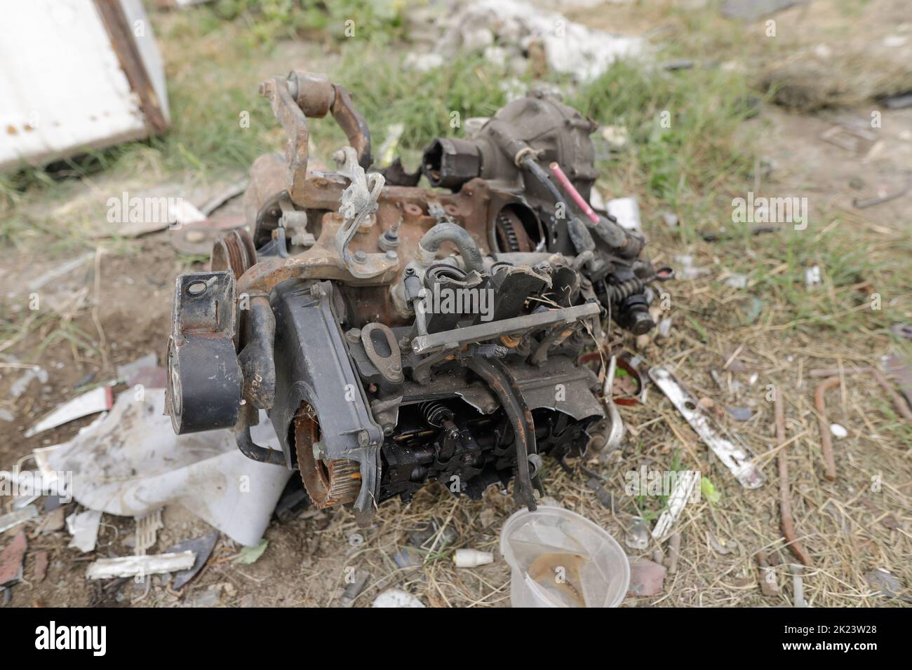 Sarulesti, Romania - September 22, 2022: Details with car engines on the ground inside a scrap yard. Stock Photo