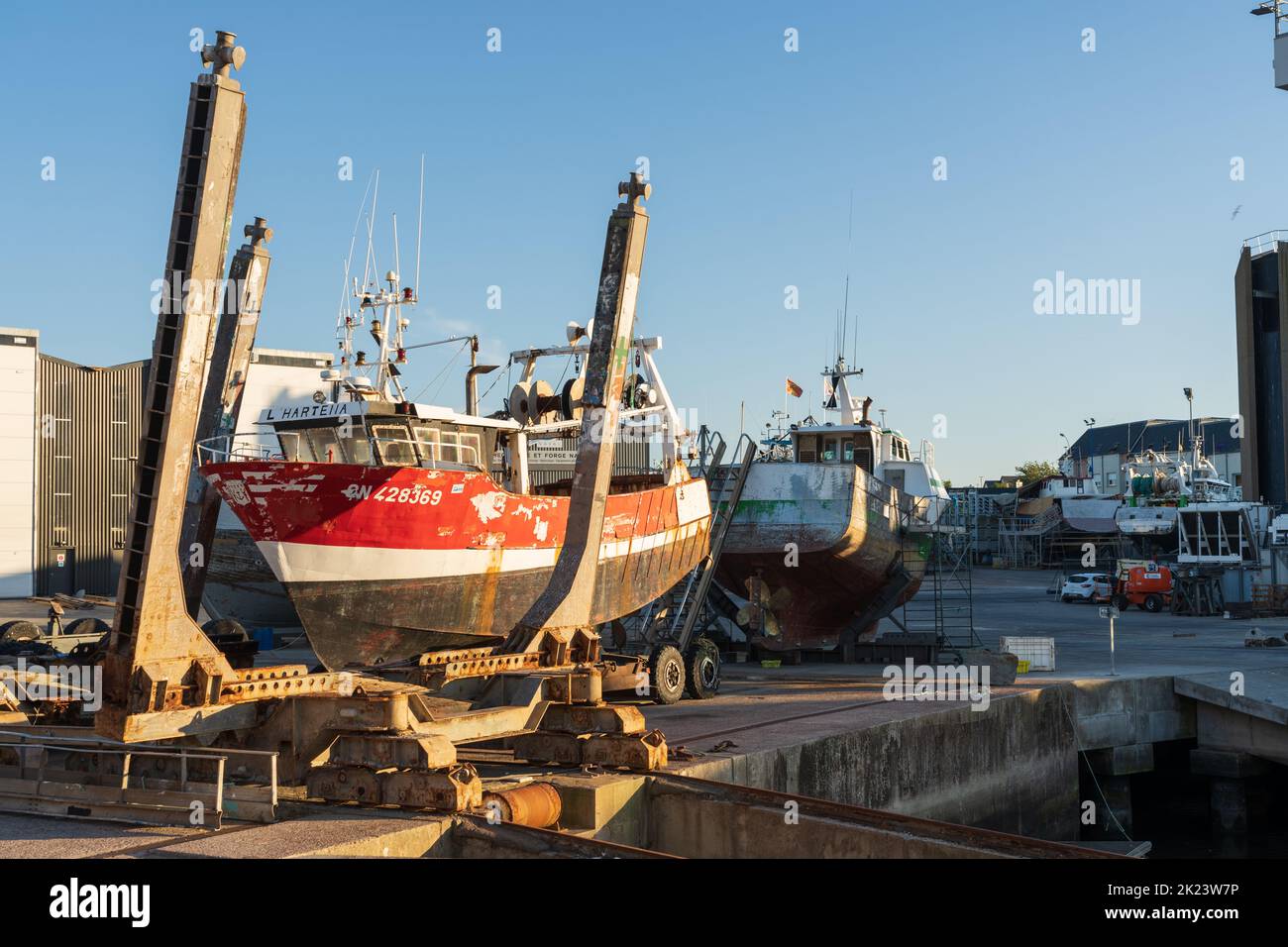 Sea fishing trawlers undergoing repairs at the boatyard in Port-en-Bessin Stock Photo