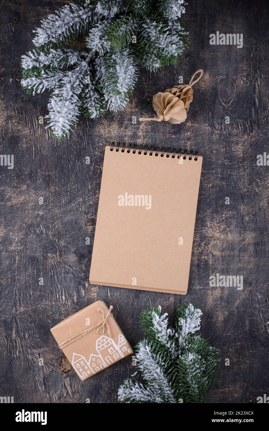 Christmas composition with empty craft notebook Stock Photo