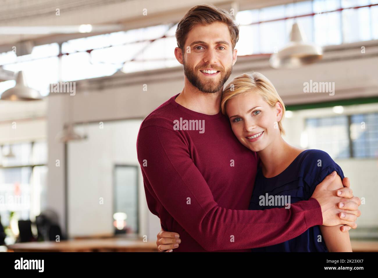 Shes the only partner I need. a couple working together in an open office. Stock Photo