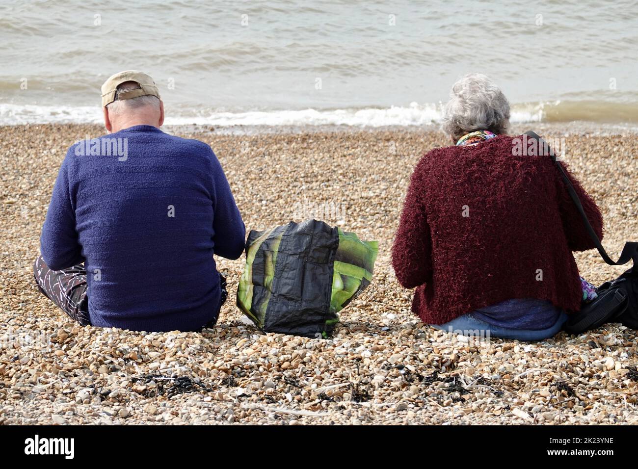 Felixstowe, Suffolk, UK - 22 September 2022 : A couple having lunch on the beach. Stock Photo