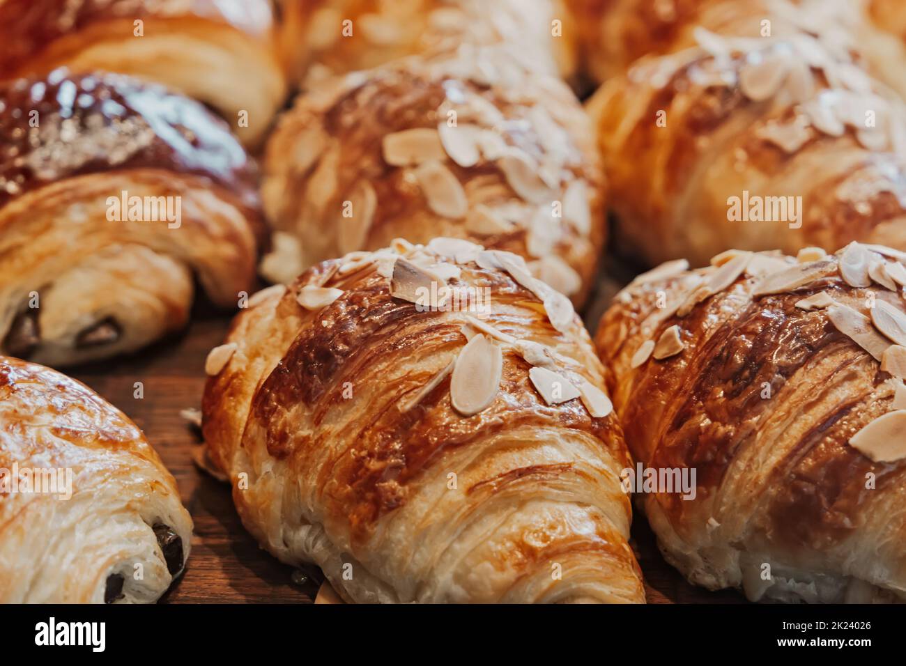 Fresh almond and chocolate croissants at a bakery. Stock Photo