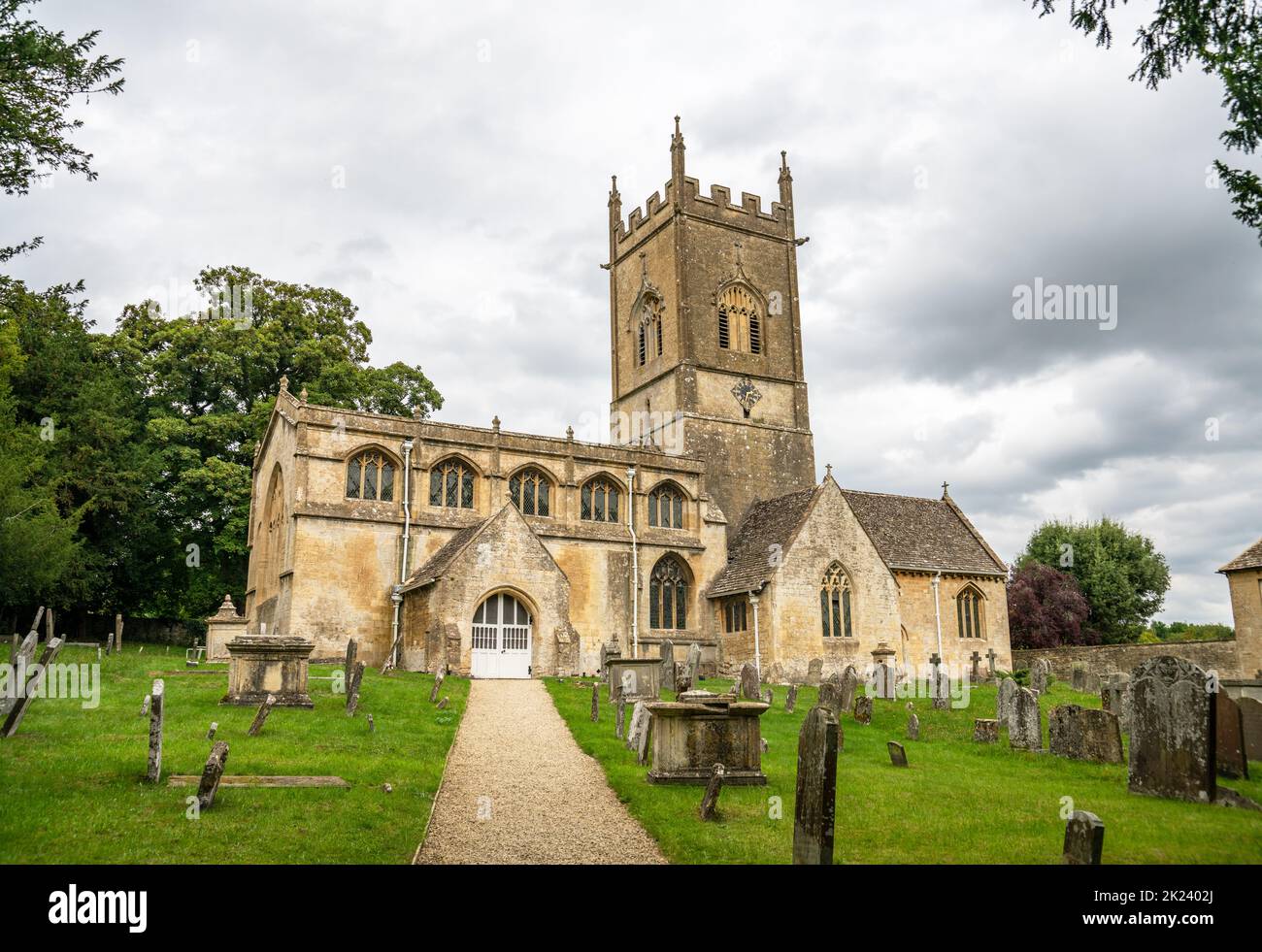 12th Century church of St Michael and All Angels, Withington, Gloucestershire, United Kingdom Stock Photo