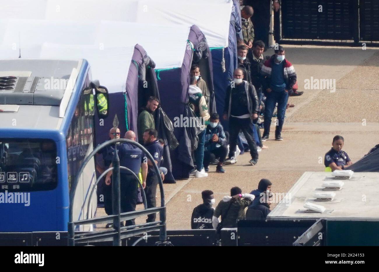 Groups of people thought to be migrants are housed in tents after being brought in to Dover, Kent, from Border Force vessels following a number of small boat incidents in the Channel. Picture date: Thursday September 22, 2022. Stock Photo