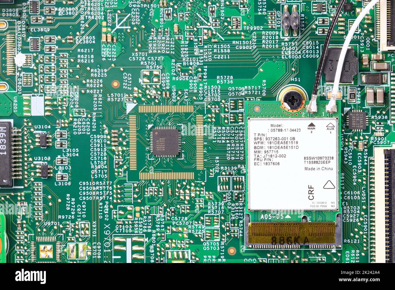 Mini pci wireless network adapter or wireless Mini PCI Express Card on computer circuit board near installed microprocessor. Stock Photo