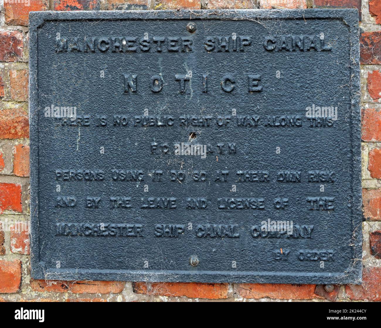 Cast iron black MSC, Manchester Ship canal Notice, there is no public right of way, persons using it do so at their own risk, By Order Stock Photo