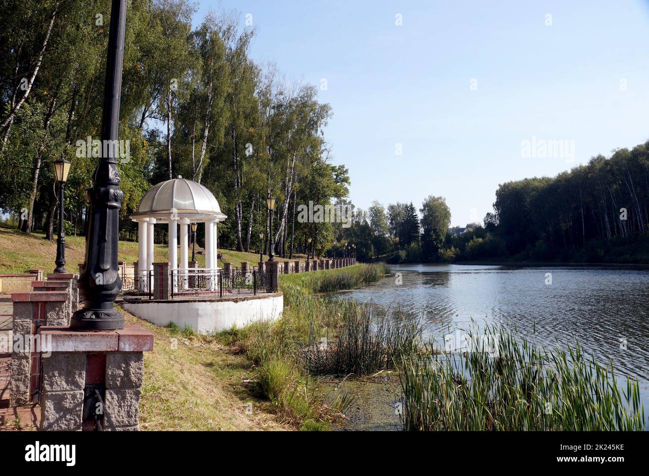 Rotunda on the Bank of a pond in the city Park in Gorki, Belarus Stock Photo