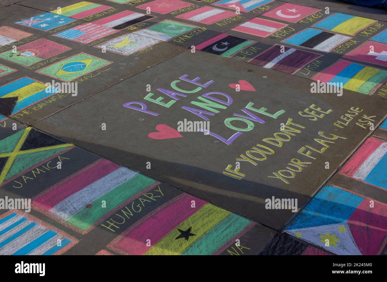 A picture of country flags drawn on the pavement by a street artist