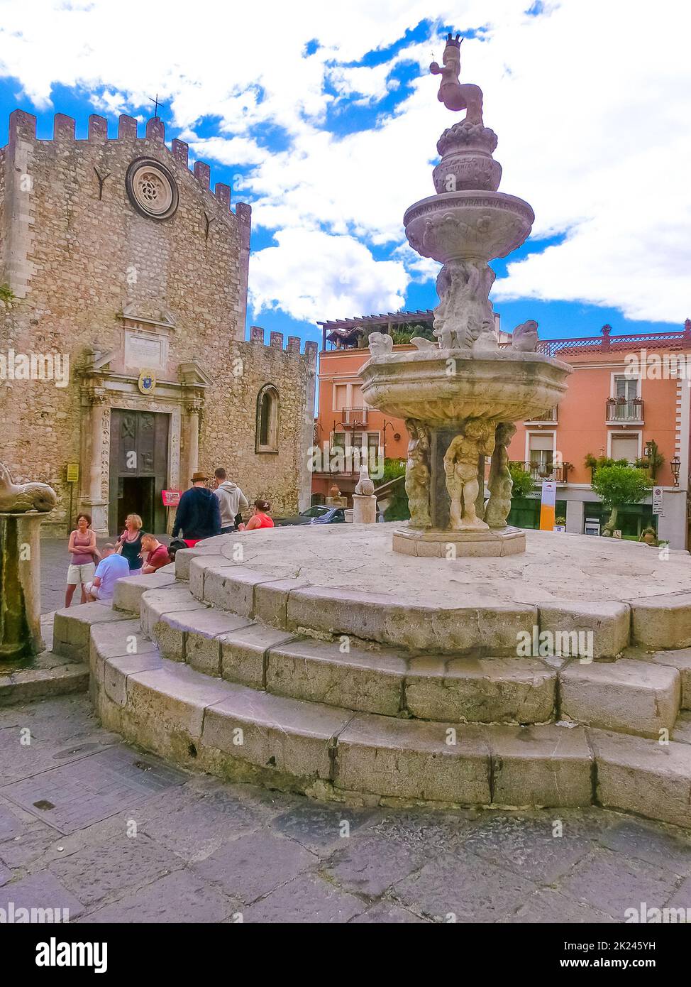 Taormina, Sicily, Italy - May 05, 2014: The people near Duomo Catherdal in Taormina city in Sicily. Cathedral of Taormina is a medieval church dedicat Stock Photo